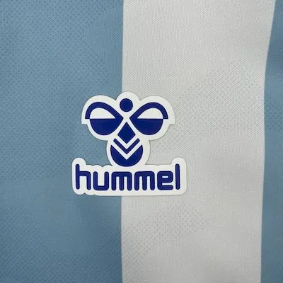 Camisa I Málaga | 25/26 Torcedor Hummel - Branca e Azul